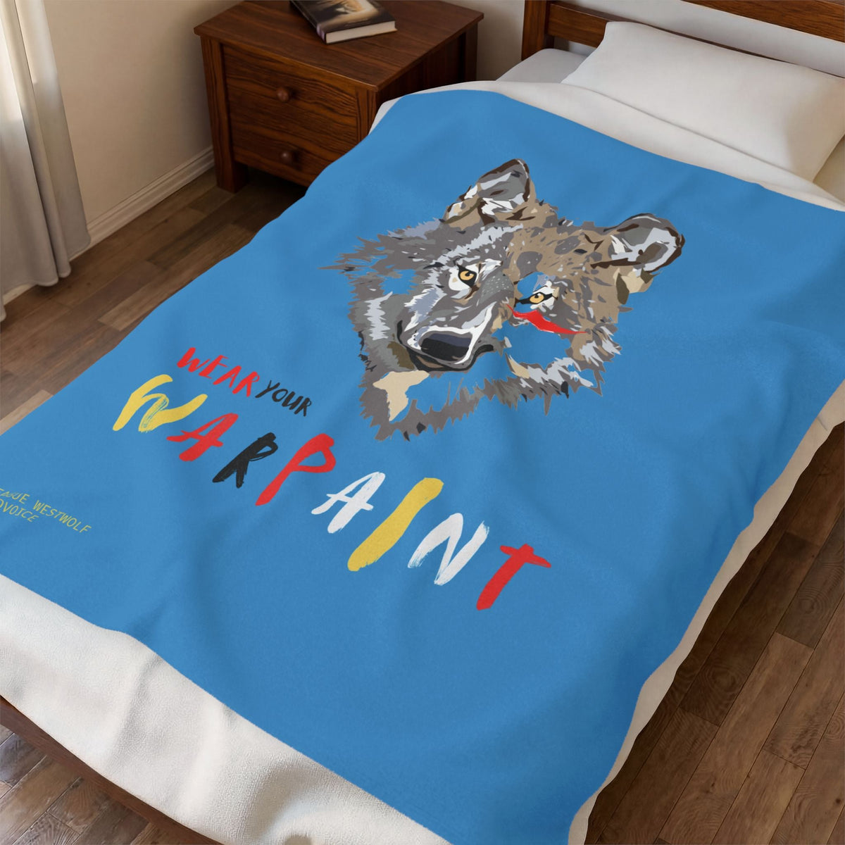 Wear Your WarPaint velveteen plush blanket on a bed